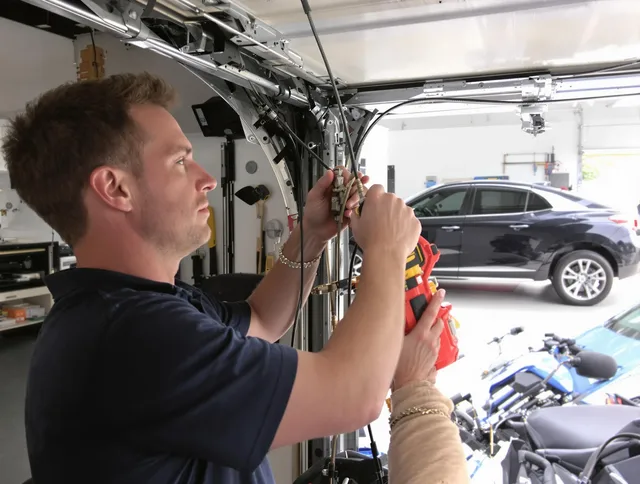 Tamiami Garage Door Repair safety certified technician performing cable replacement in Tamiami