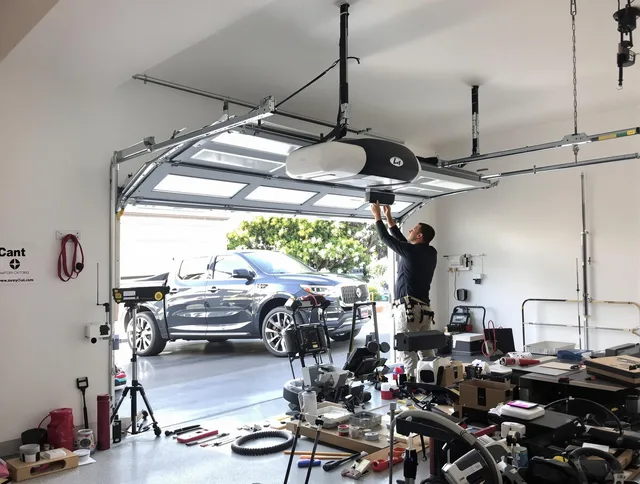 Tamiami Garage Door Repair specialist installing smart garage door opener system in Tamiami home