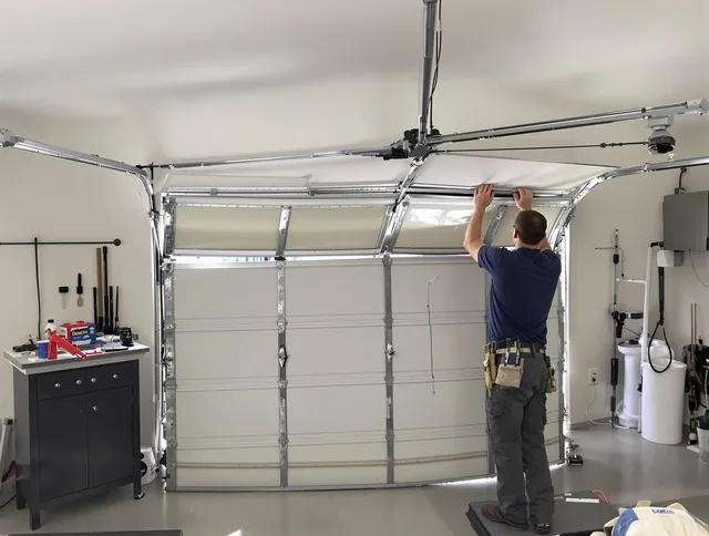 Tamiami Garage Door Repair specialist performing precise section replacement on Tamiami garage door